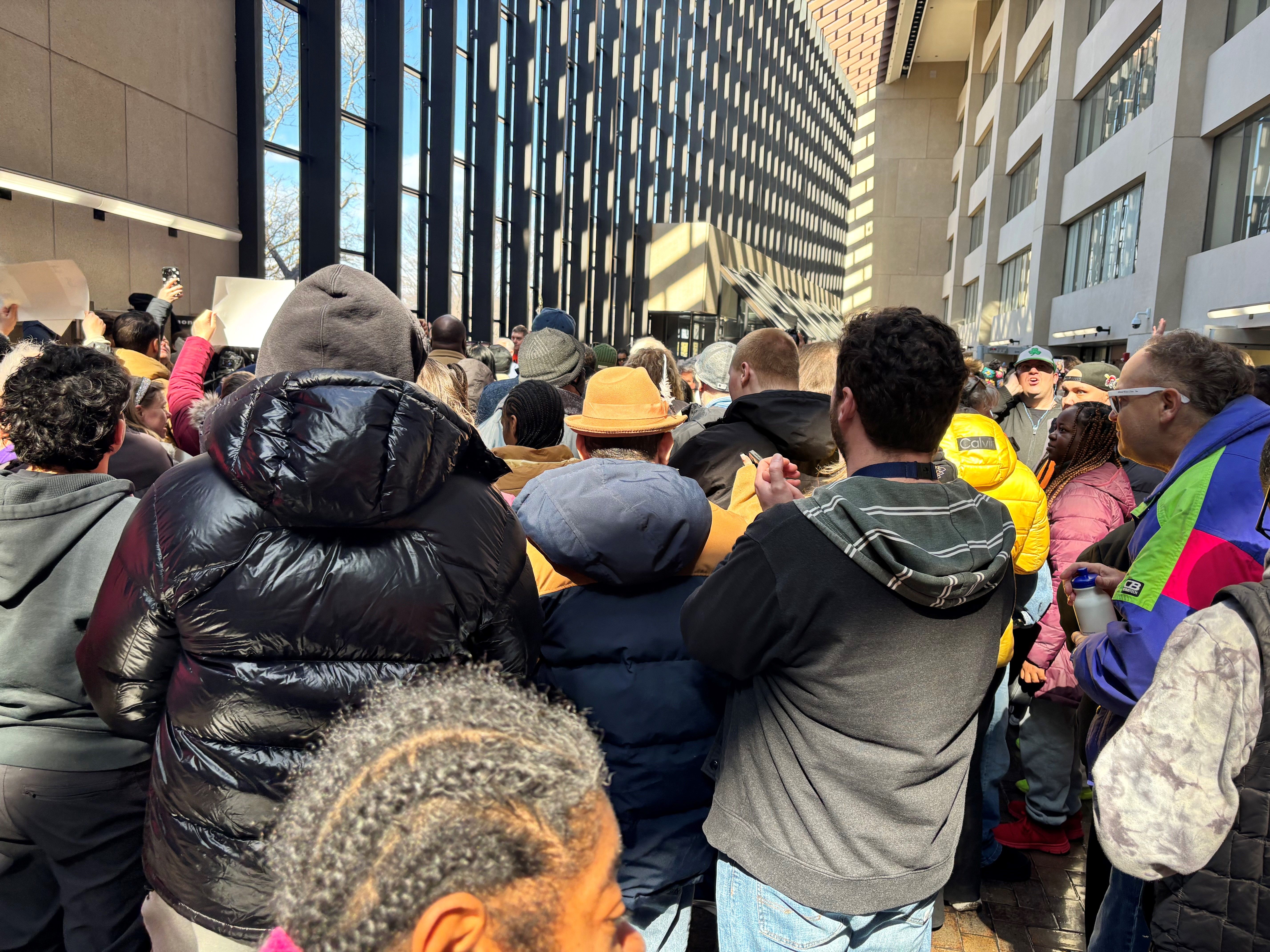 individuals gathered for rally outside